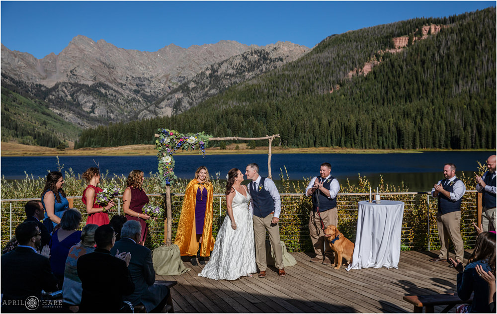 Outdoor wedding ceremony on a sunny day in Vail on the deck at Piney River Ranch