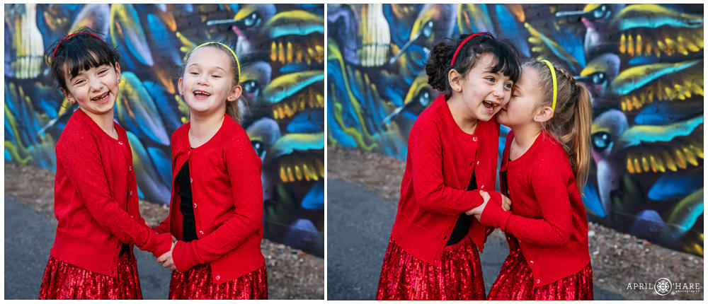 Adorable candid pictures of two sisters laughing together at a Rino Street art family photography session in Denver