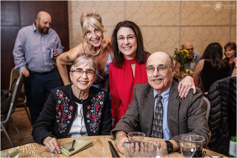 Candid family photo taken at dinner table at a bar mitzvah party at the Lincoln Center in Fort Collins Colorado