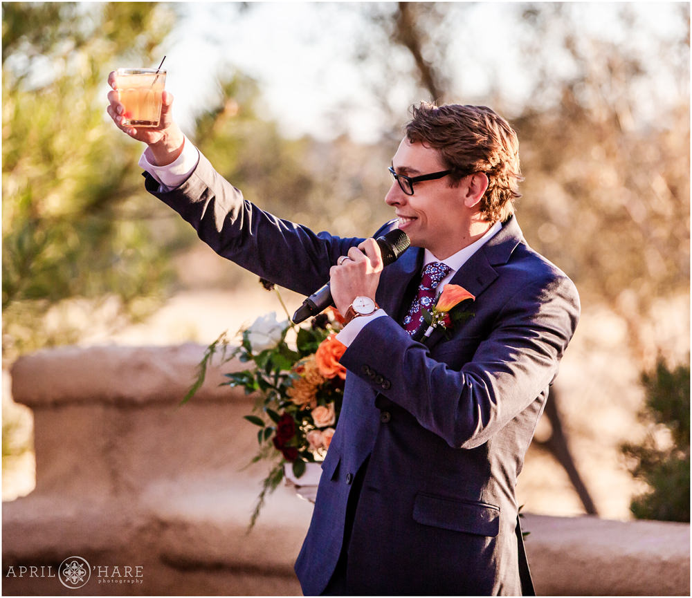Groom toast at his outdoor Colorado wedding during fall at Villa Parker