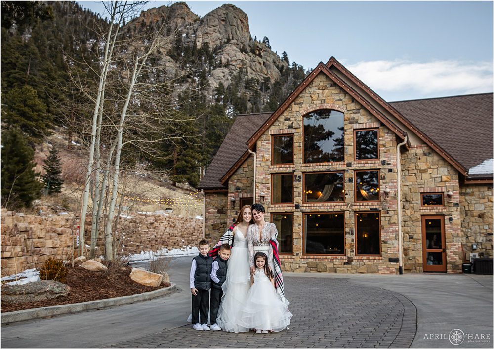 Cute portrait of a family on moms' wedding day at Della Terra in Estes Park