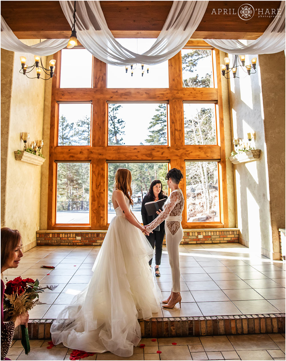 Pretty Indoor wedding ceremony at Della Terra in Estes Park