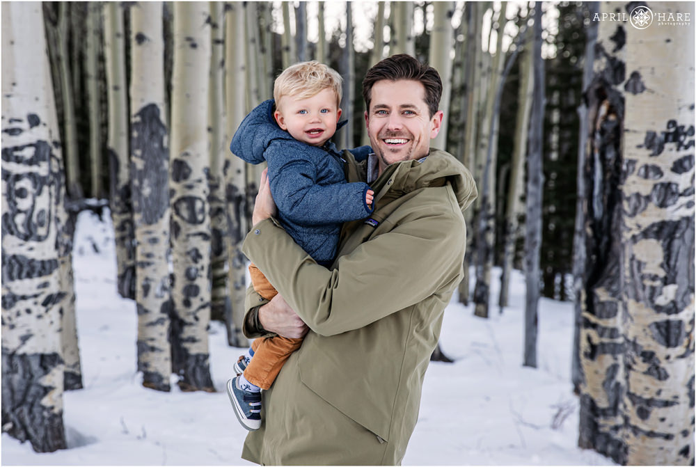 A father with his son in an aspen tree grove in Evergreen Colorado