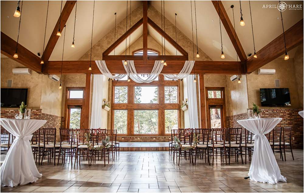 Wide angle view of an indoor wedding ceremony set up at Della Terra Mountain Chateau during Christmas season