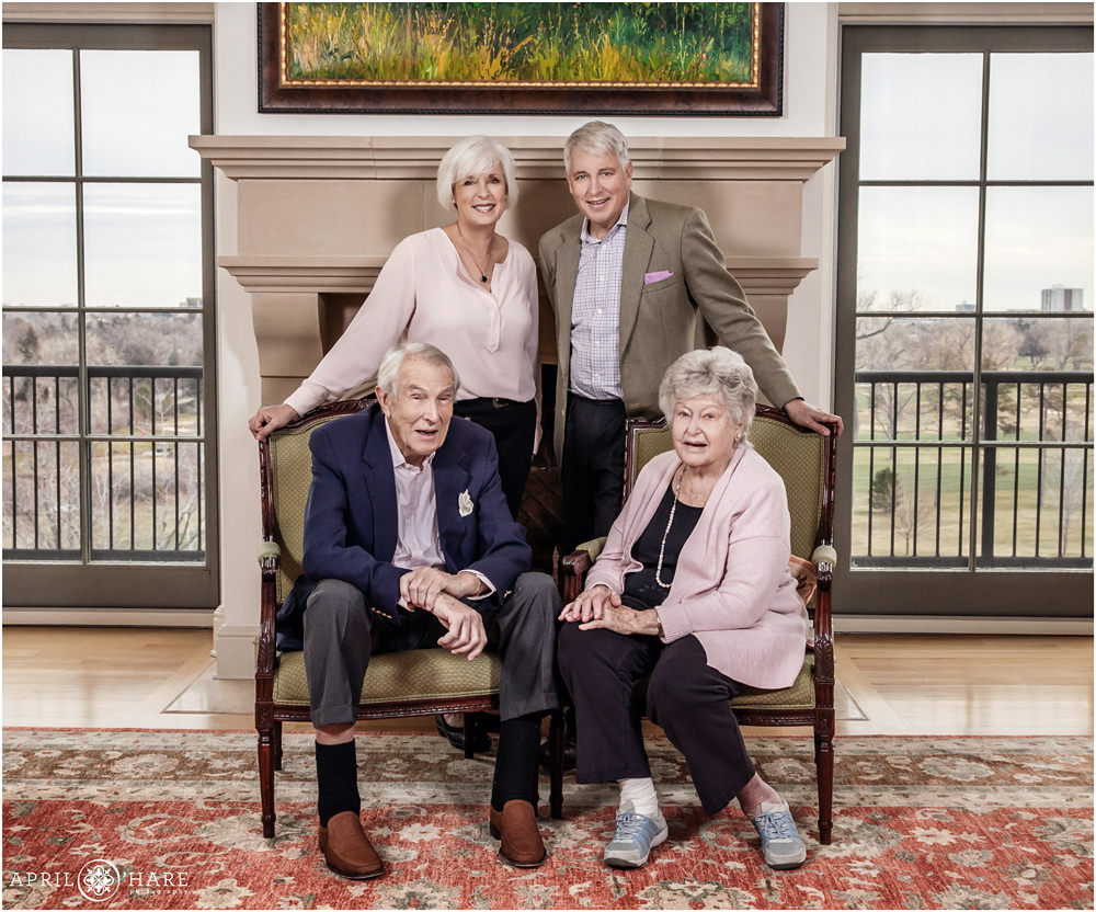 Two adult children pose with their parents at their home in Denver Colorado