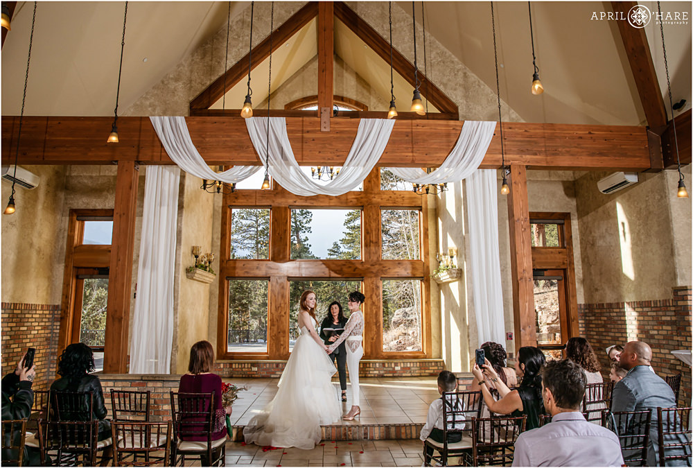 Gorgeous indoor wedding ceremony for two brides at Della Terra during Winter