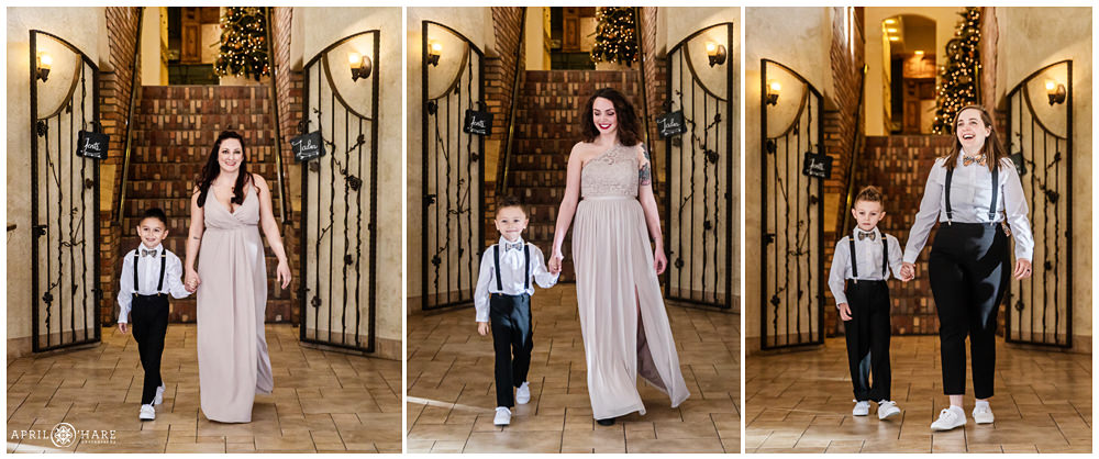 Walking down the aisle at indoor wedding ceremony at Della Terra in Estes Park