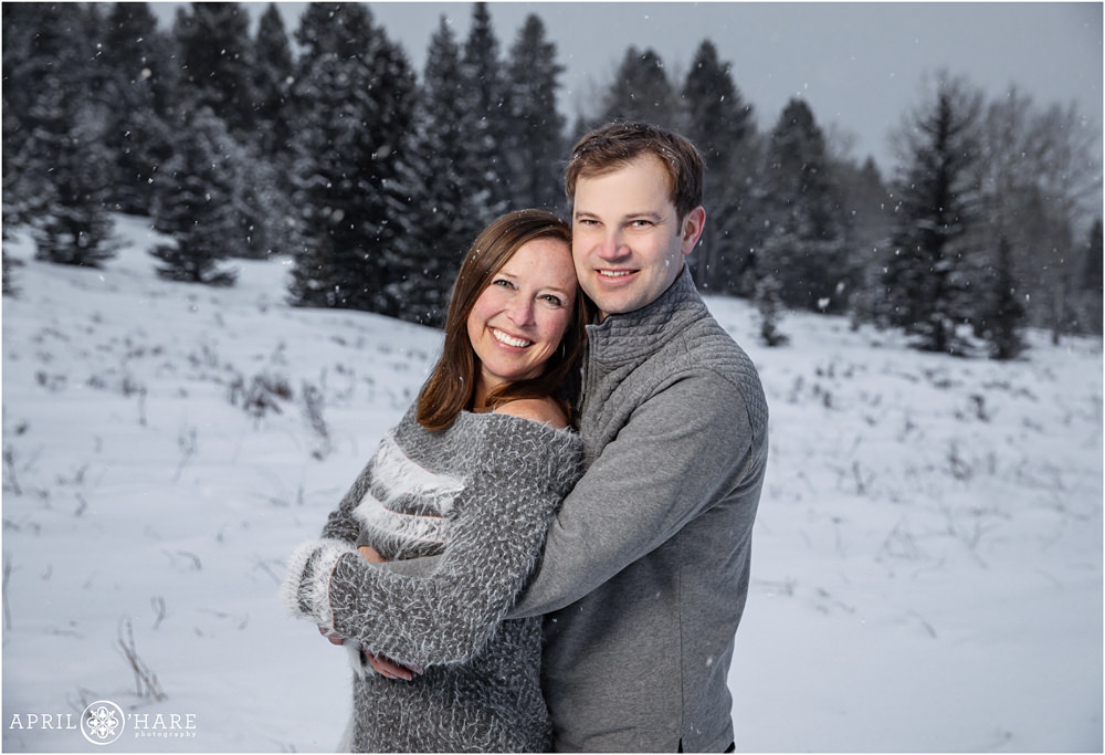 Mom and Dad get their own alone photo at pretty snowy winter family session in Evergreen Colorado