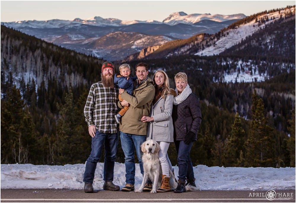 Colorado mountain family portrait with white golden retriever on Squaw Pass Road at Sunset