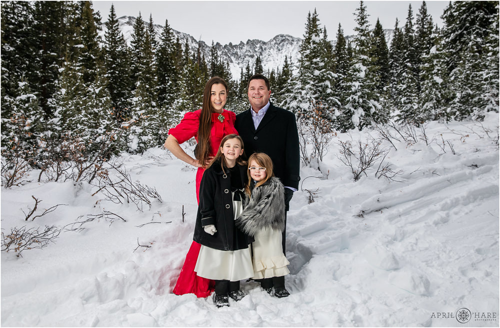 Classic Christmas family portrait at Mayflower Gulch near Leadville Colorado with pretty mountain backdrop