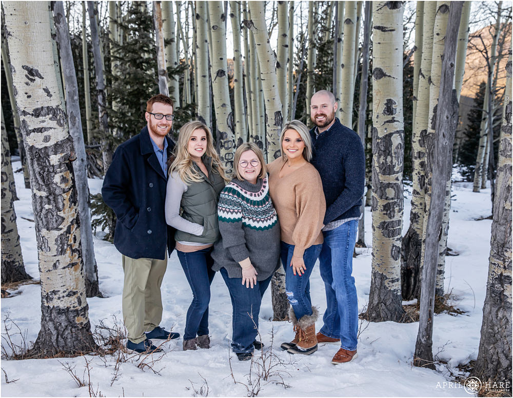 A family portrait created in an aspen tree forest in Evergreen Colorado