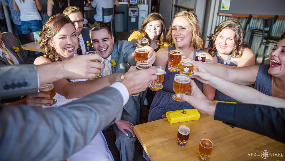 Wedding party celebrates at a Colorado Brewery Wedding Reception