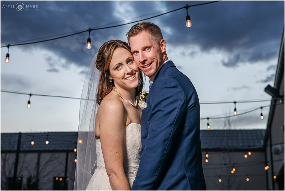 Sunset with patio lights couples portrait at Black Forest Wedgewood Weddings