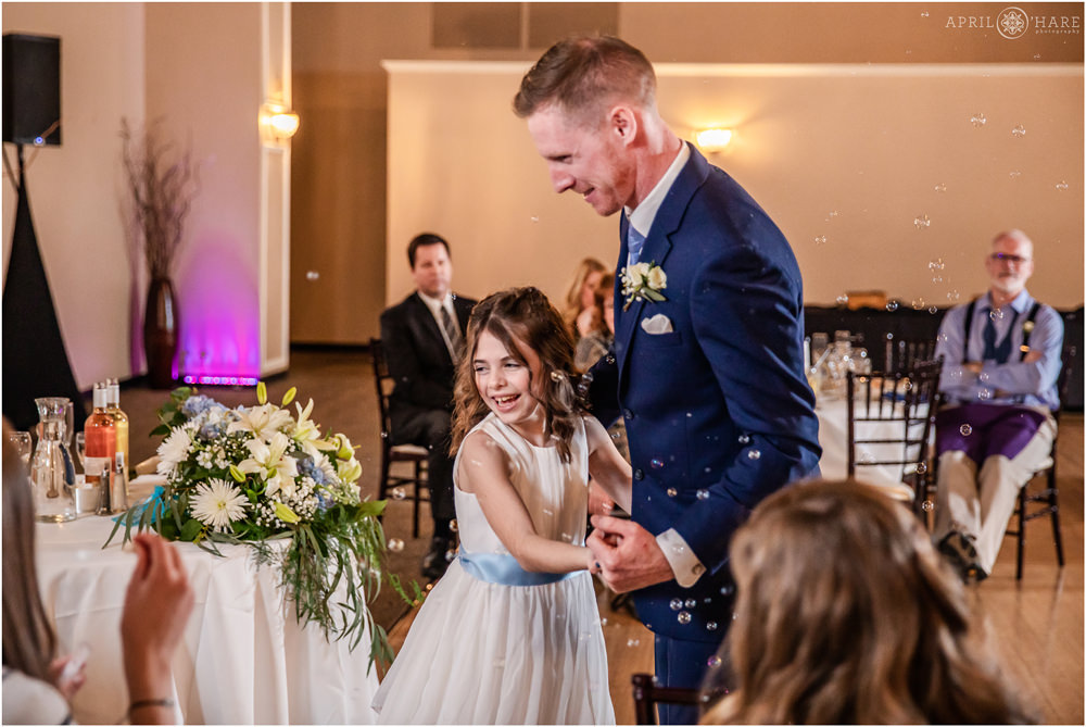 Stepdad dances with stepdaughter at wedding