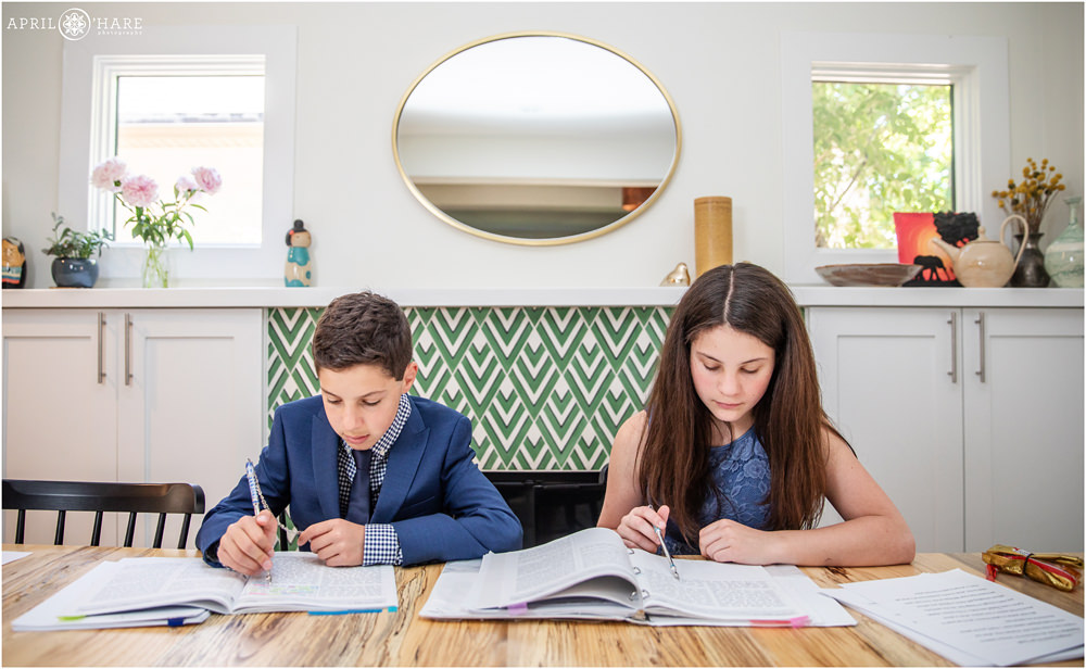 Fraternal twins study for their Denver B'Nai Mitzvah in at their home in Colorado