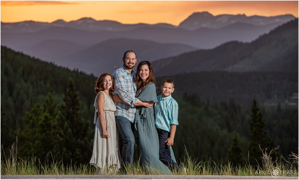A family of four is photographed at sunset on Squaw Mountain Road