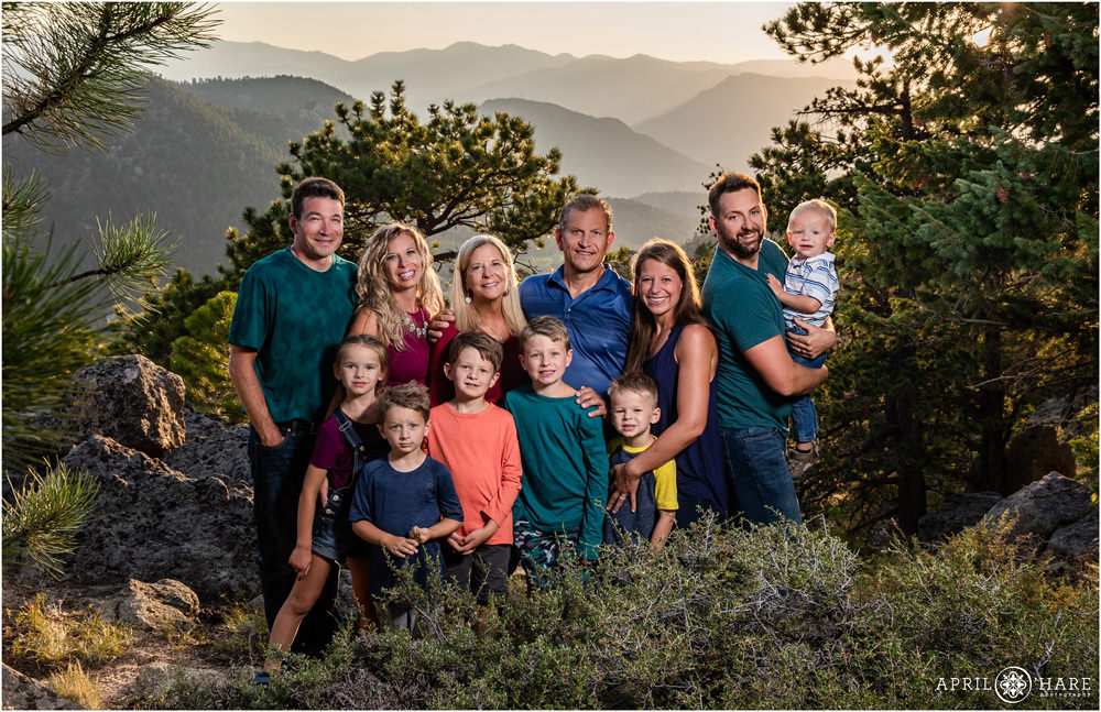 Beautiful sunset portrait of an extended family at their Colorado mountain home in Estes Park