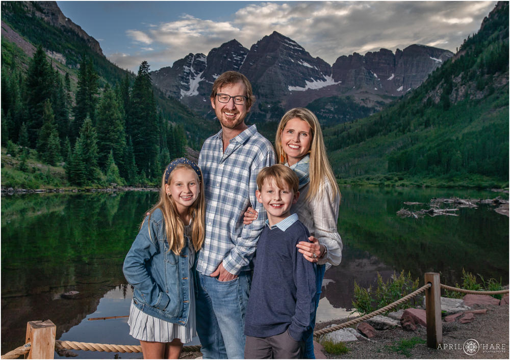 A family at sunset with Maroon Bells backdrop in Aspen Colorado