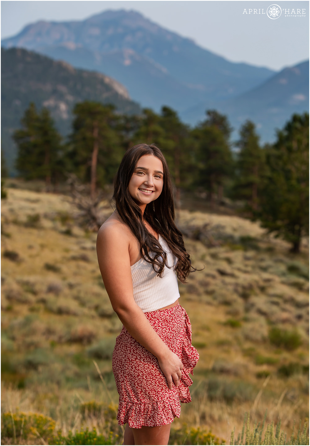 Pretty mountain backdrop in yearbook picture for Rocky Mountain National Park Senior photographer
