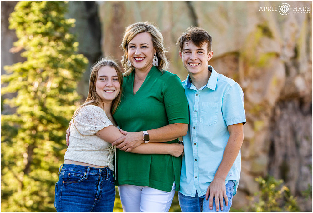 Cute family photo of a mom with her two teenage children at Lovers Leap in Southern Colorado