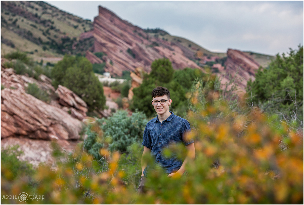 East Mount Falcon Trailhead Senior Portrait During Summer with Red Rock backdrop