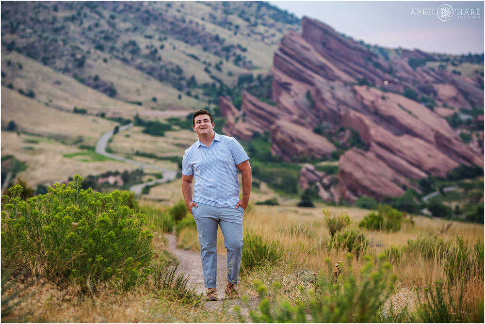 GQ style photo of a senior boy with Red Rocks Amphitheater backdrop in Morrison Colorado