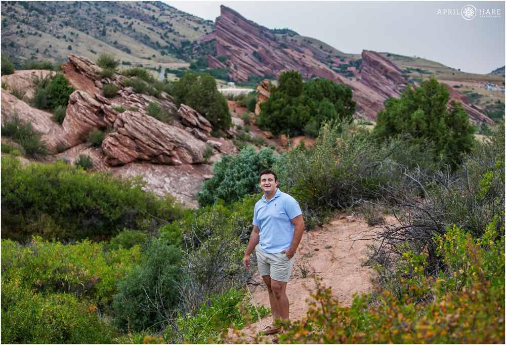 Stunning Red Rocks Scenery for a High School Senior Boy portrait during summer in Colorado
