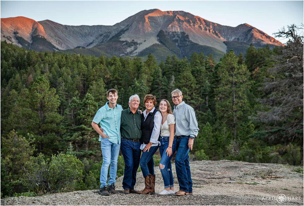 Spanish peaks family photography with Dad's side of the family in front of a pretty mountain at Sunset in Southern Colorado