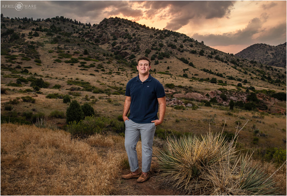 Dramatic sunset light for a High School Senior photo at East Mount Falcon in Morrison Colorado
