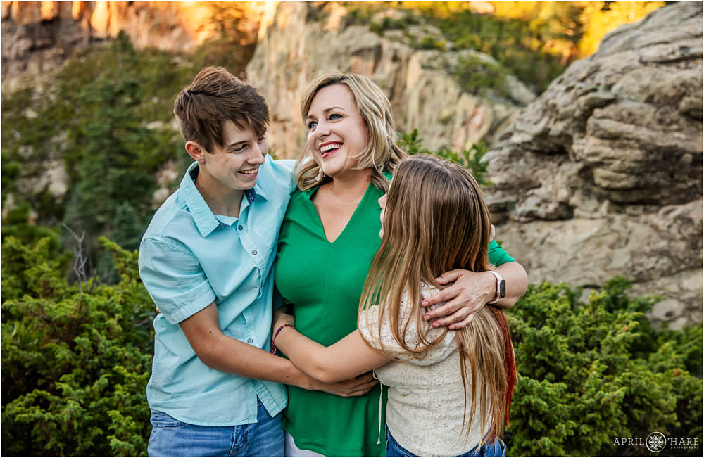 A happy candid picture of a mom with her two teenage children at Lovers Leap near La Veta Colorado