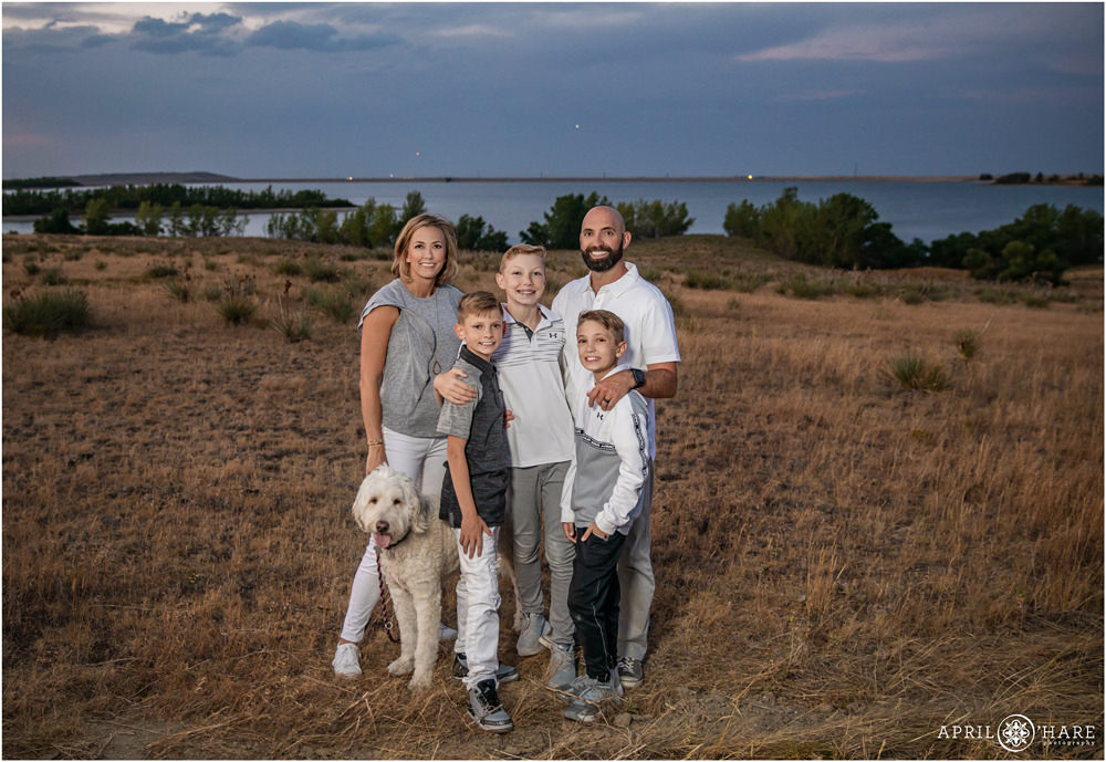 Aurora Reservoir Sunset Family Photos for family wearing white and gray