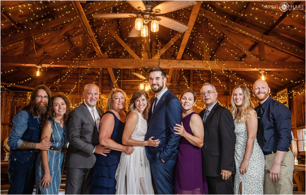 Small intimate wedding with a group of people inside small private barn in Colorado