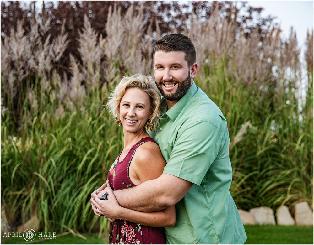Erie Colorado Family Portraits in front of tall feather grass during summer
