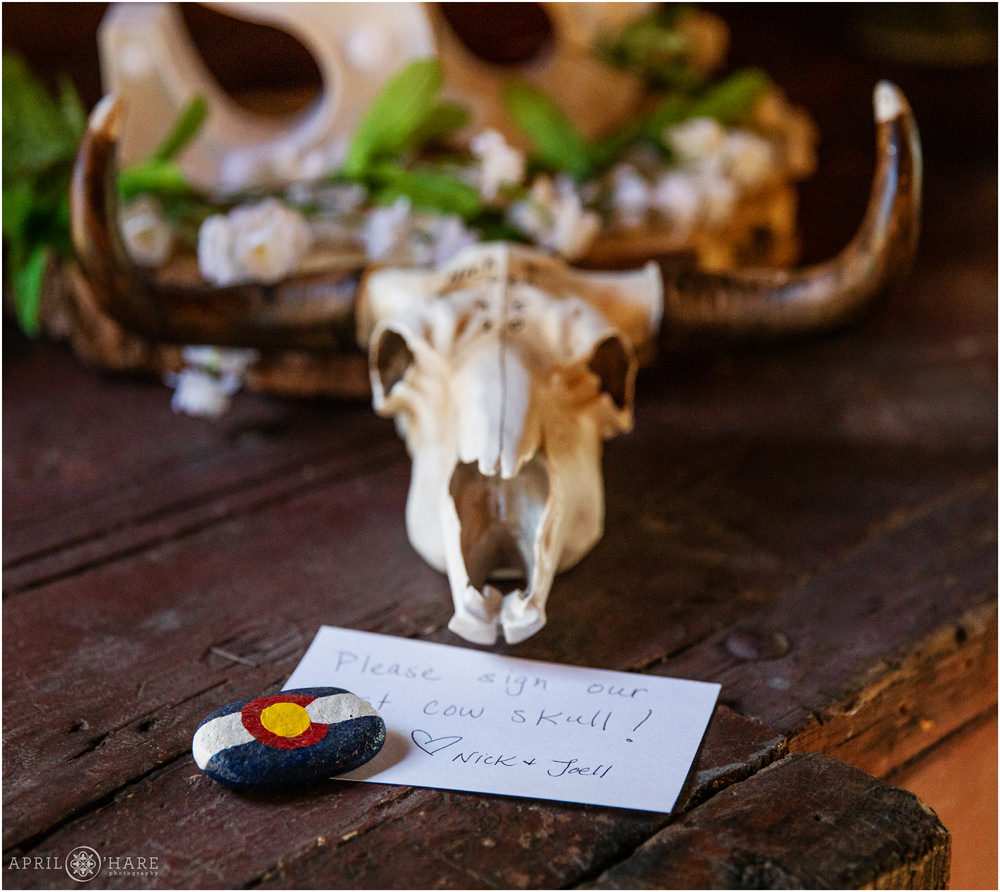 Guest sign in cow skull in Colorado at a wedding