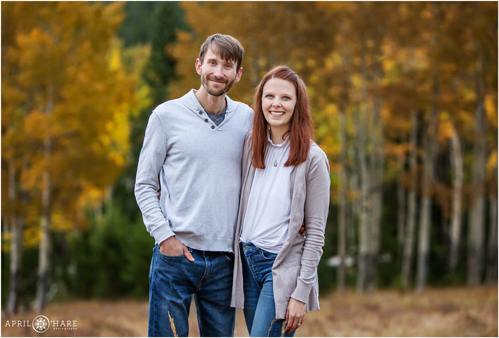 A portrait of mom and dad alone with pretty aspen tree backdrop at their family portrait session in Colorado