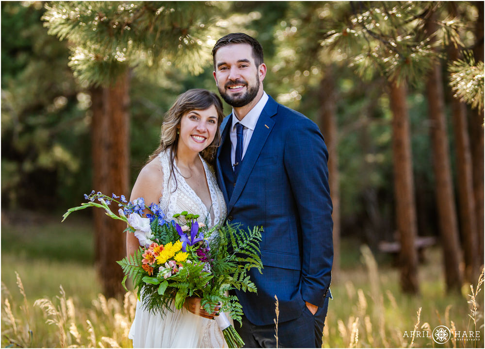 A classic wedding photo in the woods of Colorado on Lookout Mountain