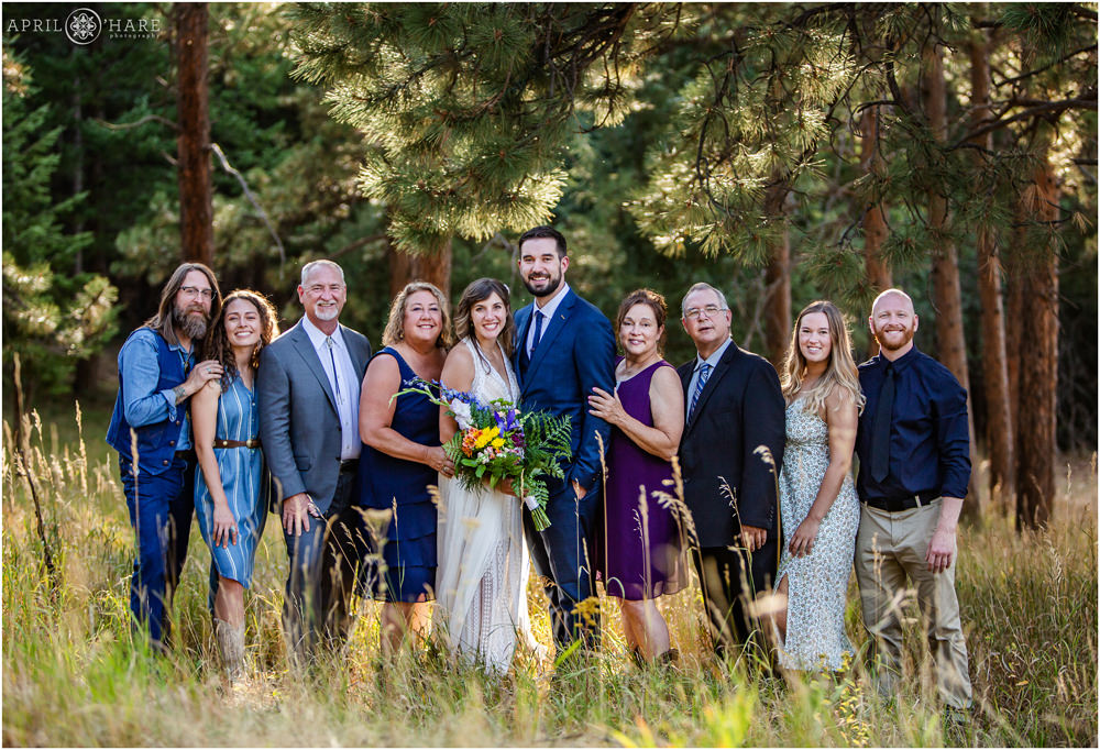 Small intimate wedding with all of the guests in the woods on Lookout Mountain in Golden Colorado