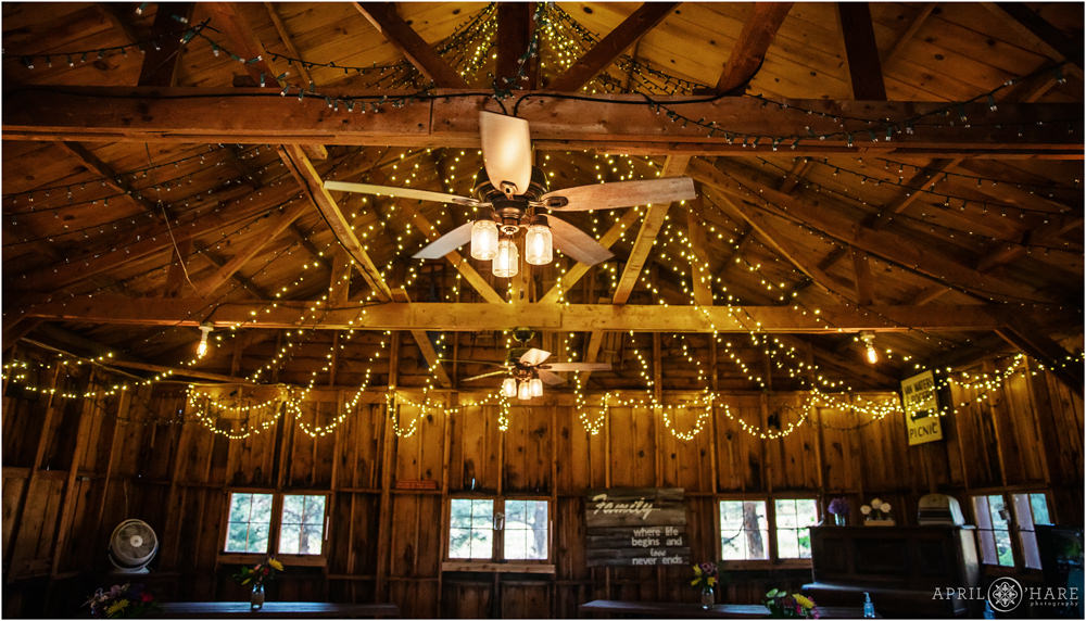 Interior barn with fan and hanging string lights in Colorado