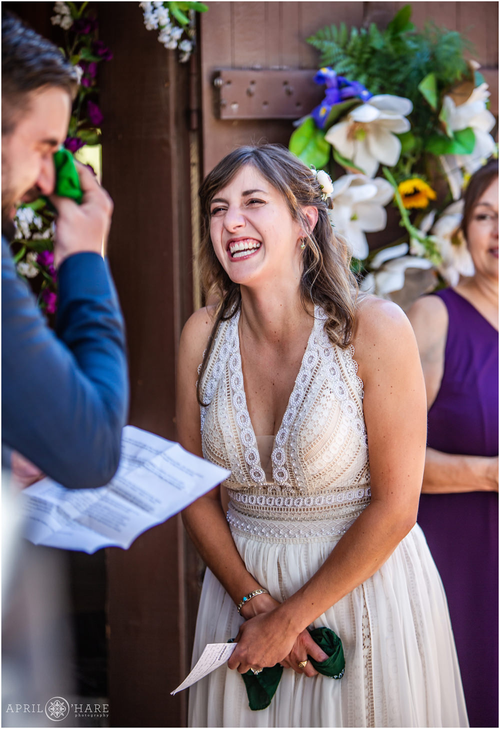 Bride laughs with her groom at their emotional outdoor wedding in Colorado at a private rental home