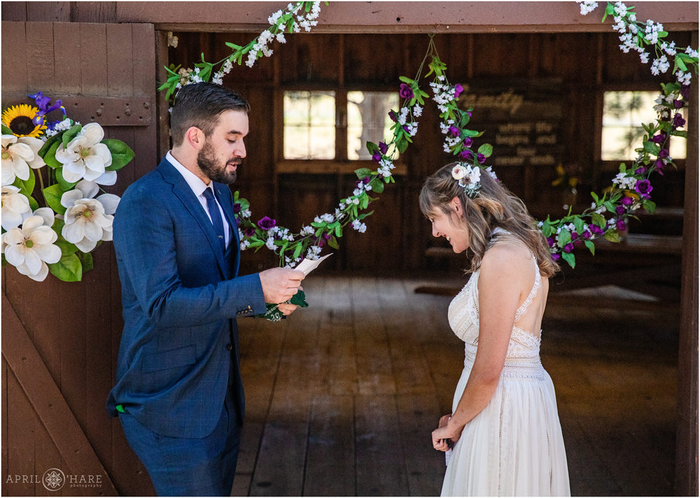 Groom reads his vows on his wedding day in Colorado
