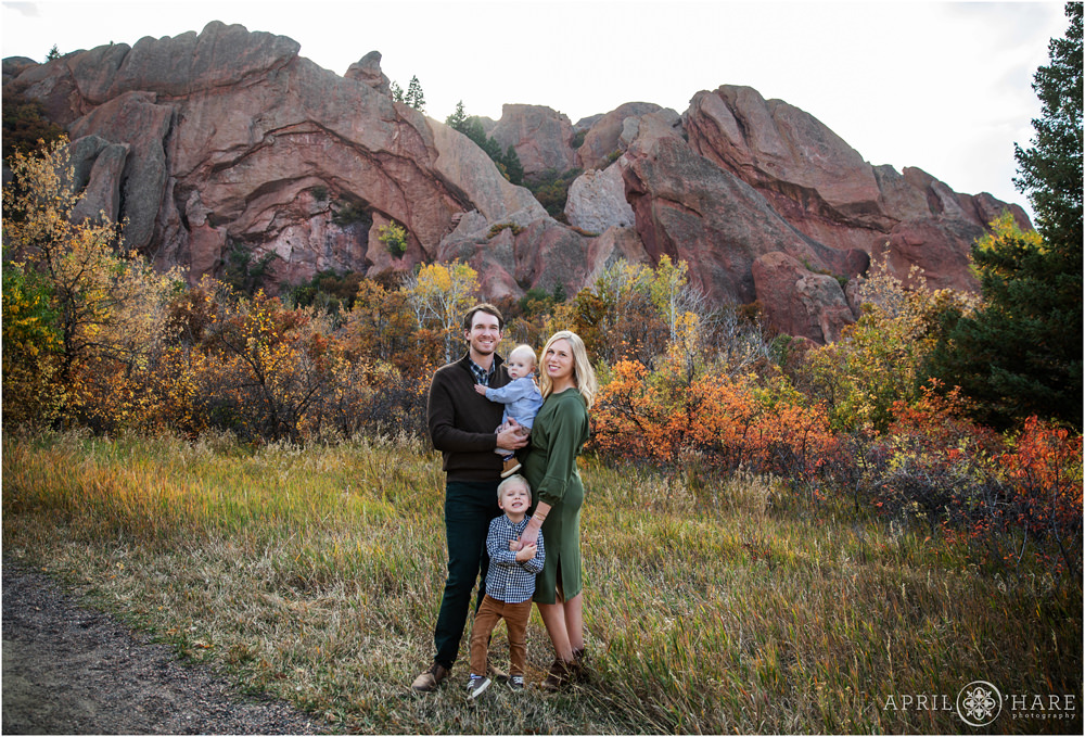 Lovely family portrait with pretty red rocks and fall color at Roxborough State Park