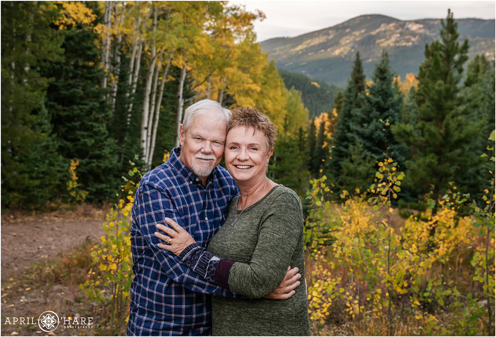 Grandparents get their own picture in the fall color at their family photo session in Evergreen Colorado
