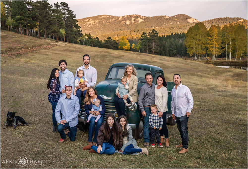 Beautiful Family Portraits with a dark green vintage truck in the Mountains of Conifer Colorado