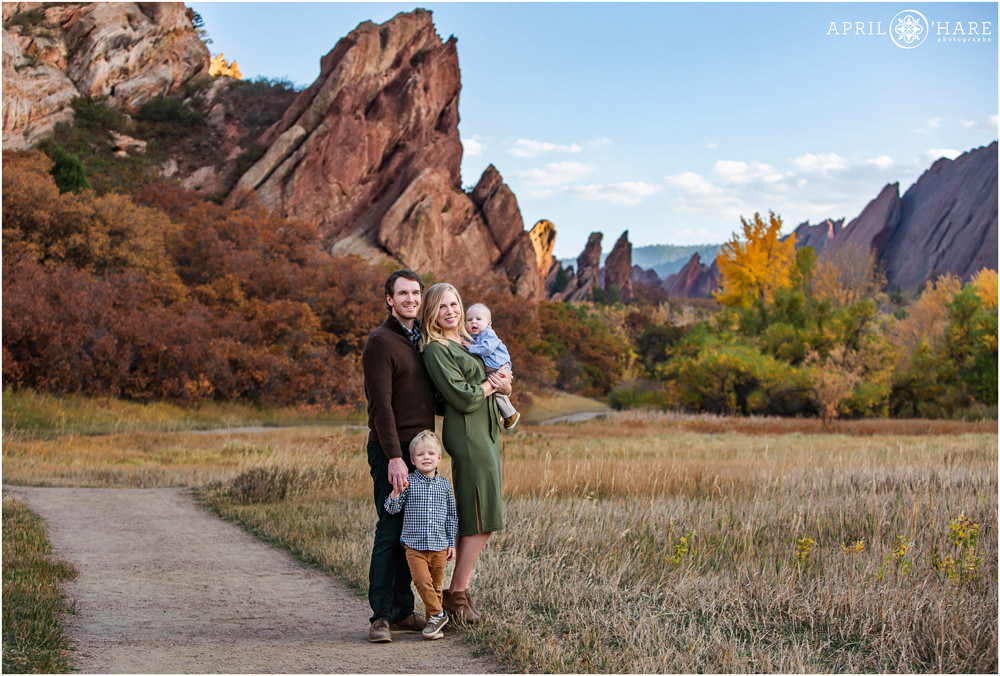 Fall color family portraits with two young boys along the trail at Roxborough State Park