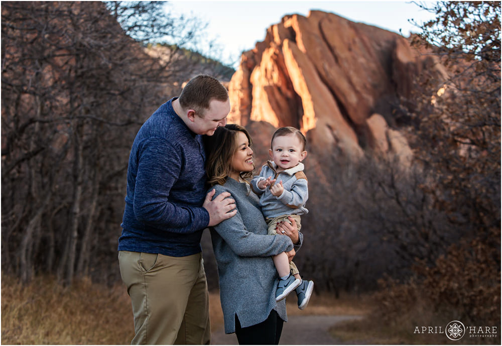 Sweet family portrait with pretty red rock backdrop at Roxborough State Park in Colorado