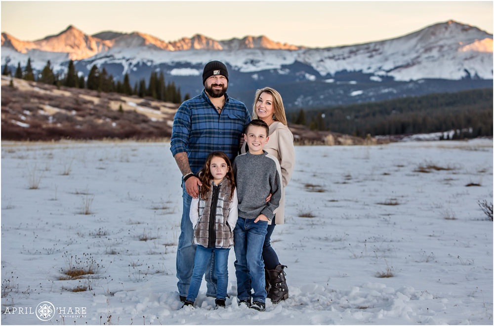 Cute family photo during winter on Shrine Pass with mountain views