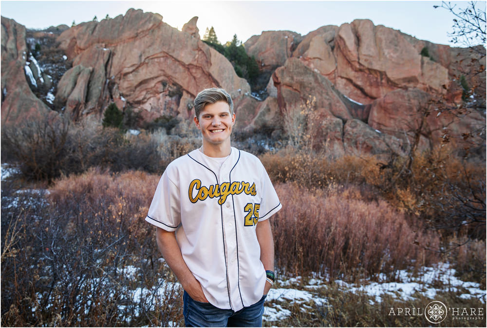 White baseball jersey senior portrait for a guy at Roxborough in Colorado