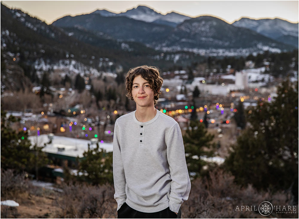 Young adult male poses at his family photography session at the Knoll-Willows Open Space in Estes Park