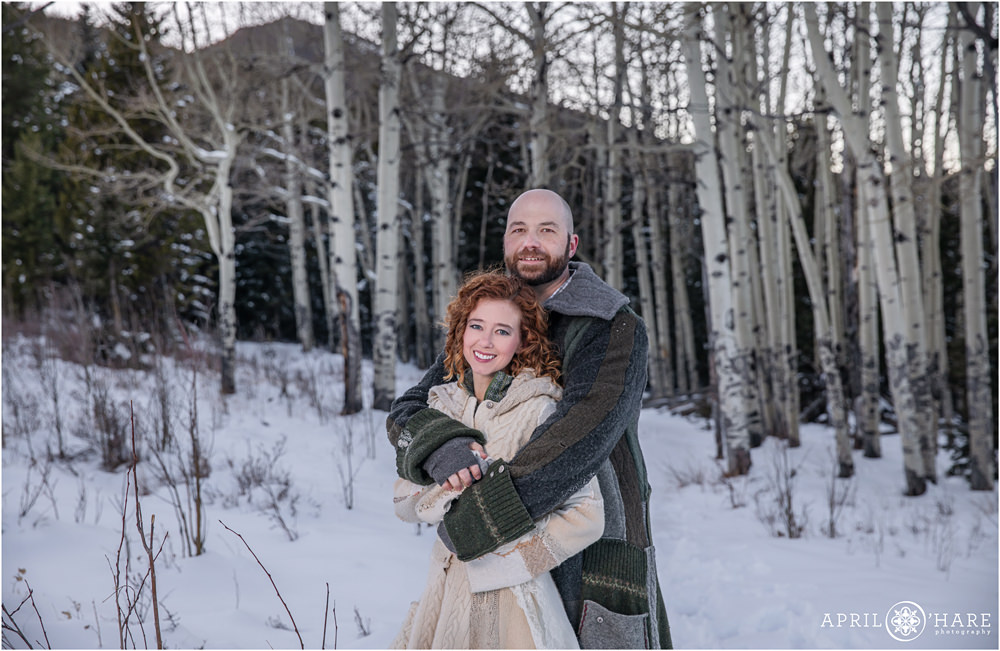 Cute married couple poses for their own separate picture with pretty aspen tree backdrop in Evergreen Colorado