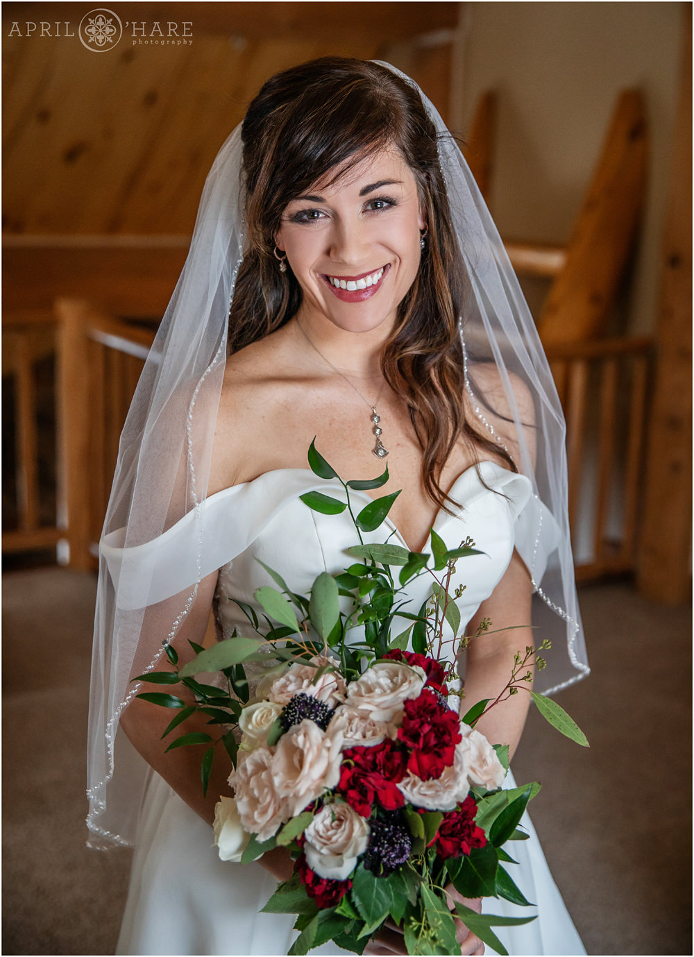Classic bride portrait with window light at a private home in Keystone Colorado during winter